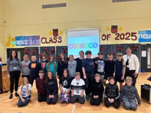 Pupils from Fair Isle Primary with FHG Engagement Officers, Suzanne Hume and Melissa Birrell, at the community event for local care home residents.